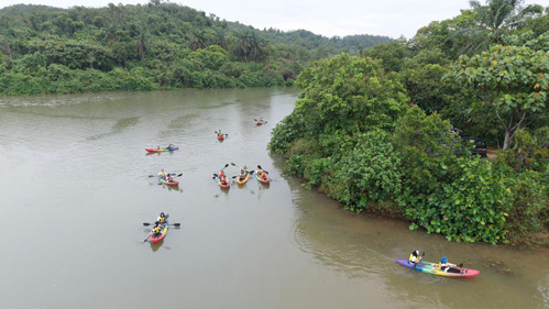 Participants kayaking along the Chicken Feet Lake in SIREH Park as part of the "Cabaran Merdeka 68" activities.